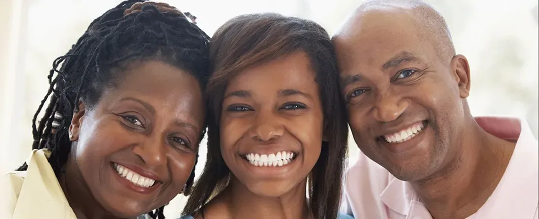 Three smiling patients