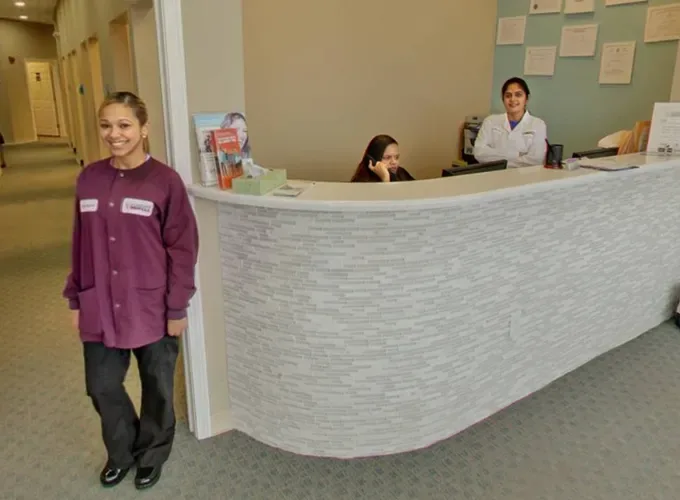 Front desk and dental team at Alright Dental